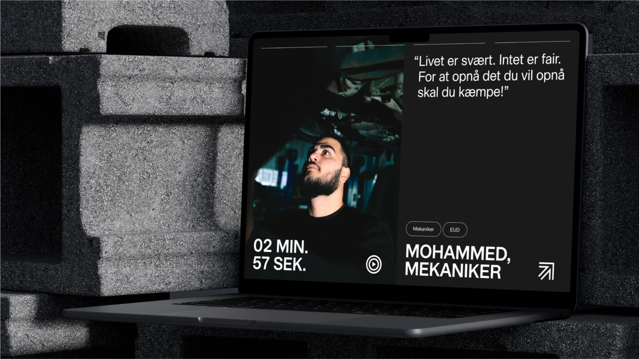 TEC.dk på en bærbar computer – et videoportræt af Mohammed, mekaniker, med citatet "Livet er svært. Intet er fair. For at opnå det du vil opnå skal du kæmpe!"